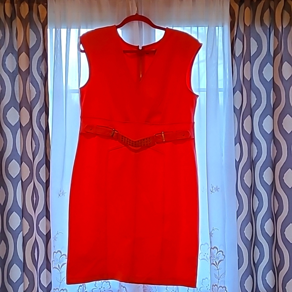 Jennifer Lopez size 16 Coral with gold zipper and belt detailing.